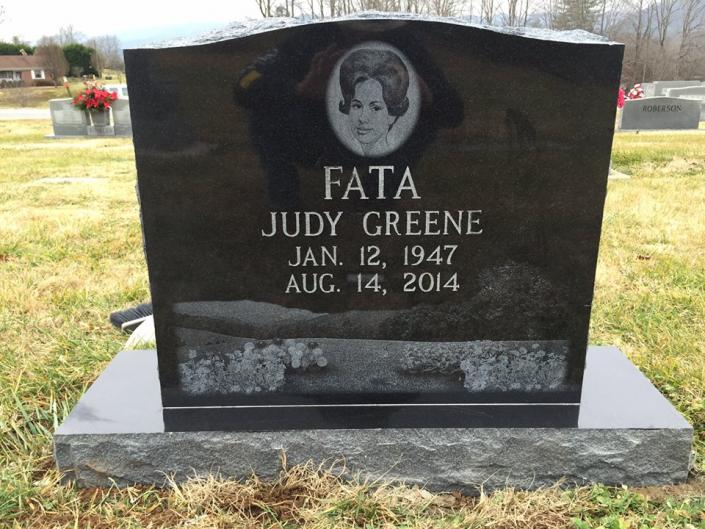 This upright granite monument was laser sketched with a special scene to honor a special woman. 